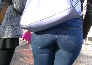 Candid redhead with peach ass in tight jeans